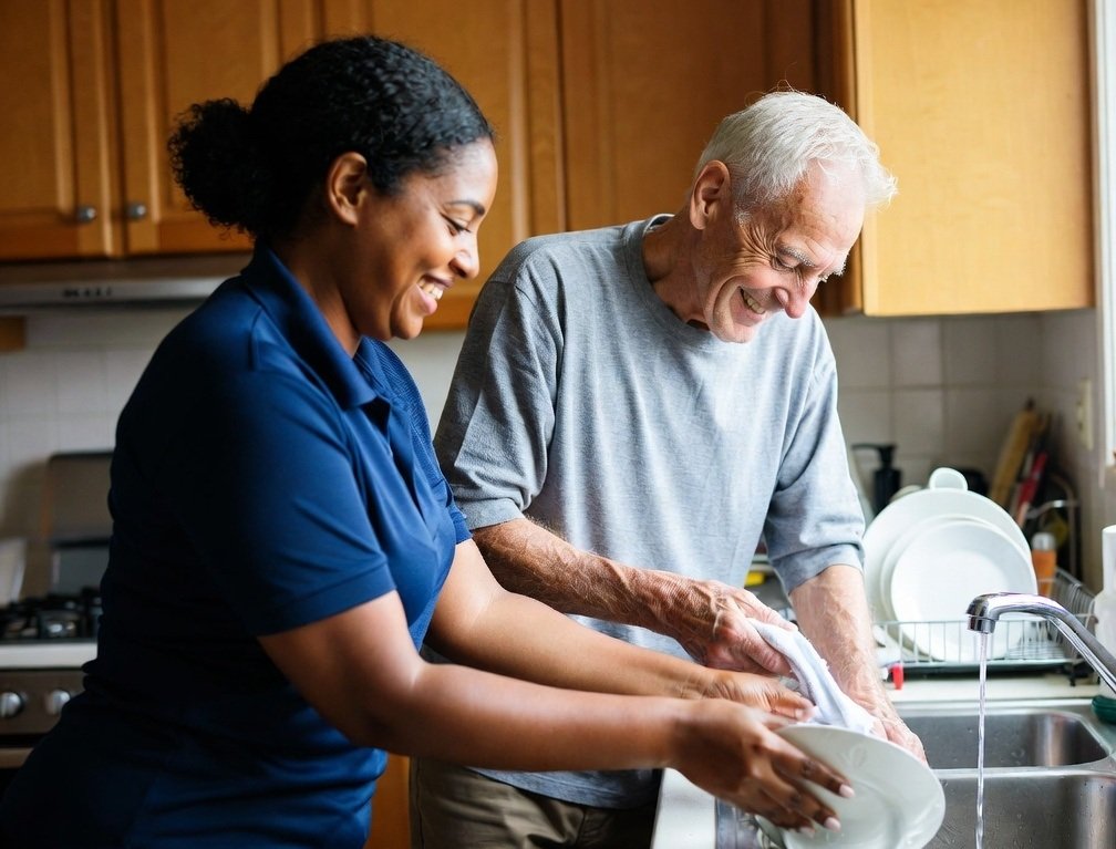 Participant in their own kitchen with a worker alongside
