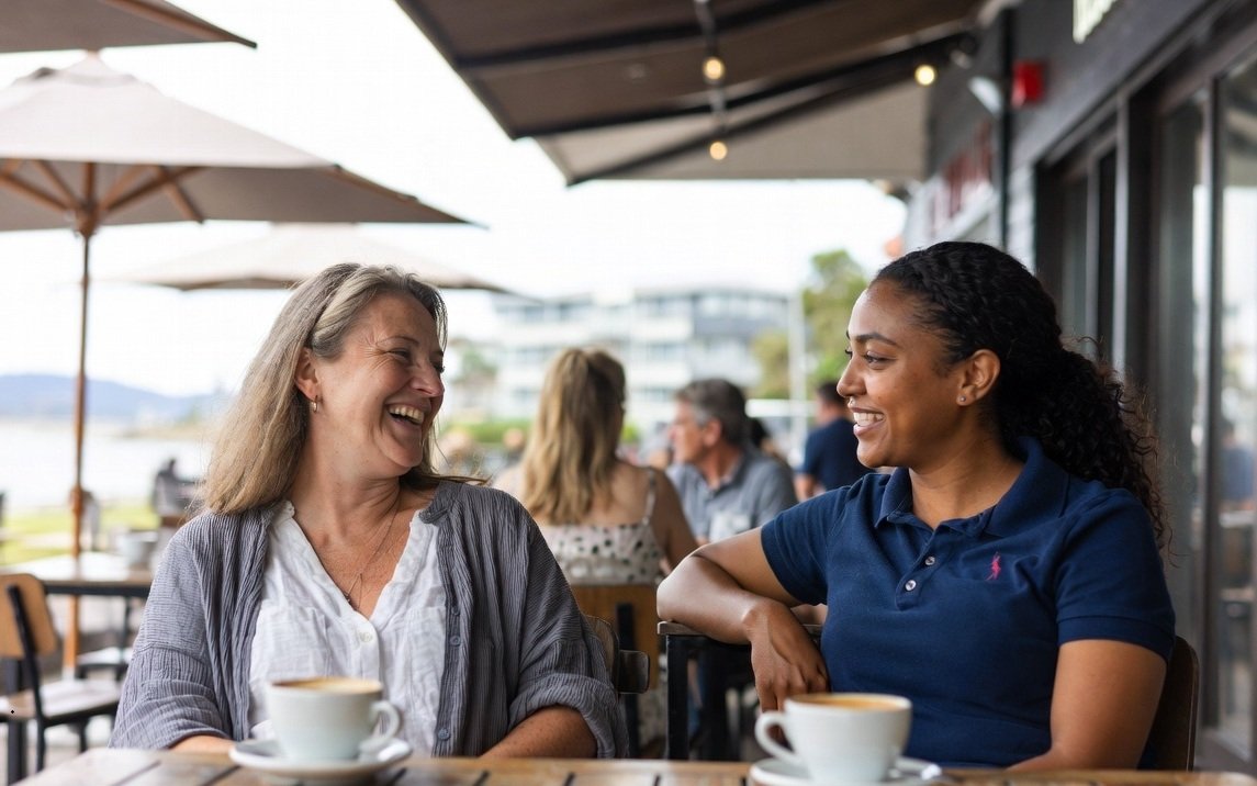 A participant and a support worker having coffee at a Mandurah cafe